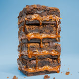 Image of stacked Killer Brownie Triple Chocolate with caramel brownies