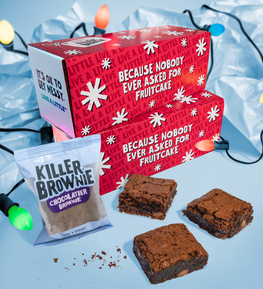 Red gift box with text and brownies on a blue background