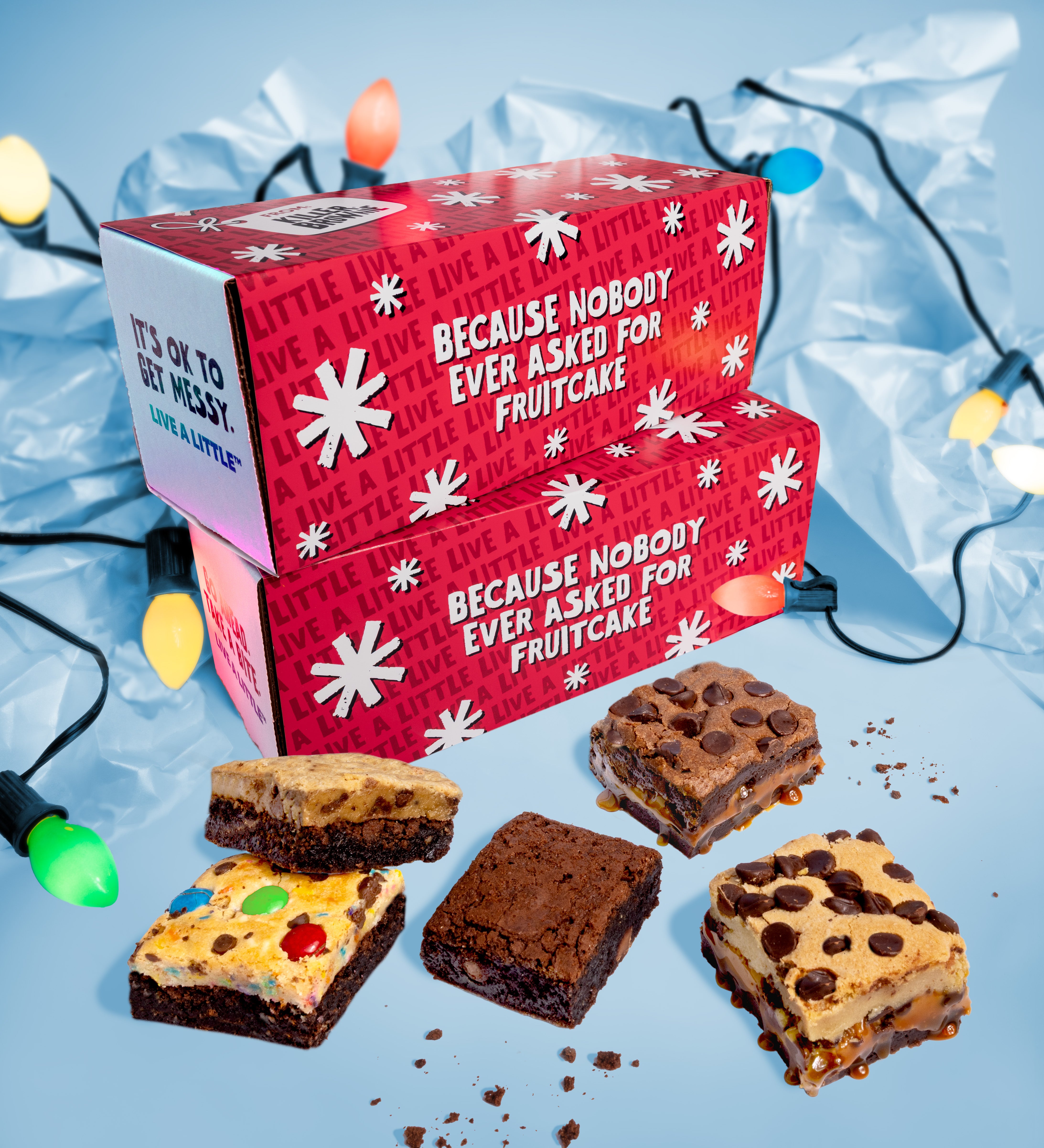 Red box with text and assorted brownies on a blue background with lights